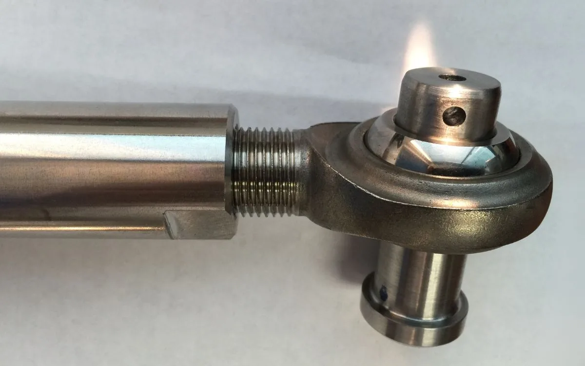 Stainless-steel connecting rod with spherical rod end for the bypass actuating linkage